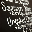 A chalkboard listing drinks