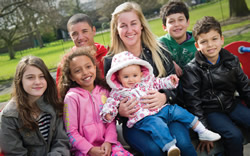 An adult with a group of children An adult with a group of children