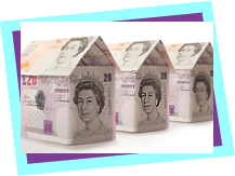 Small houses made with 10 and 20 pound notes