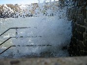 Wave crashing against stone steps