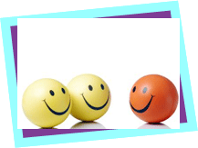 Three smiling balls