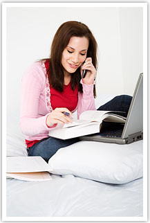 Woman with book on phone