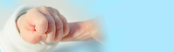 baby's hand gripping a finger