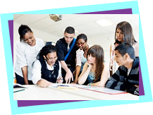 A group of young people and a teachers talking around a table A group of young people and a teachers talking around a table