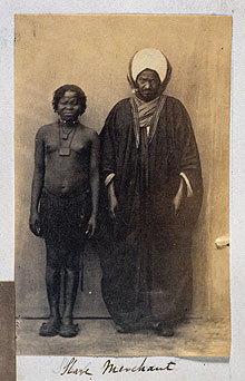 Arab slave merchant with a female slave, Cairo, c.1864