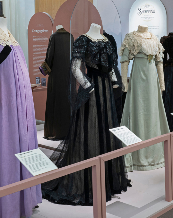 Image of the Verey Gallery at Leighton House with dresses on display