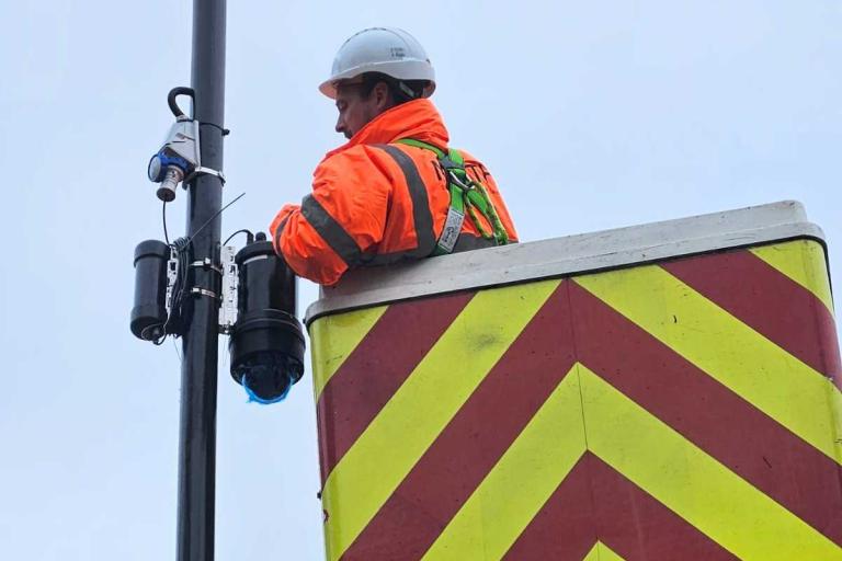 Man installing a new CCTV camera