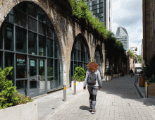 Woman walking near an arch