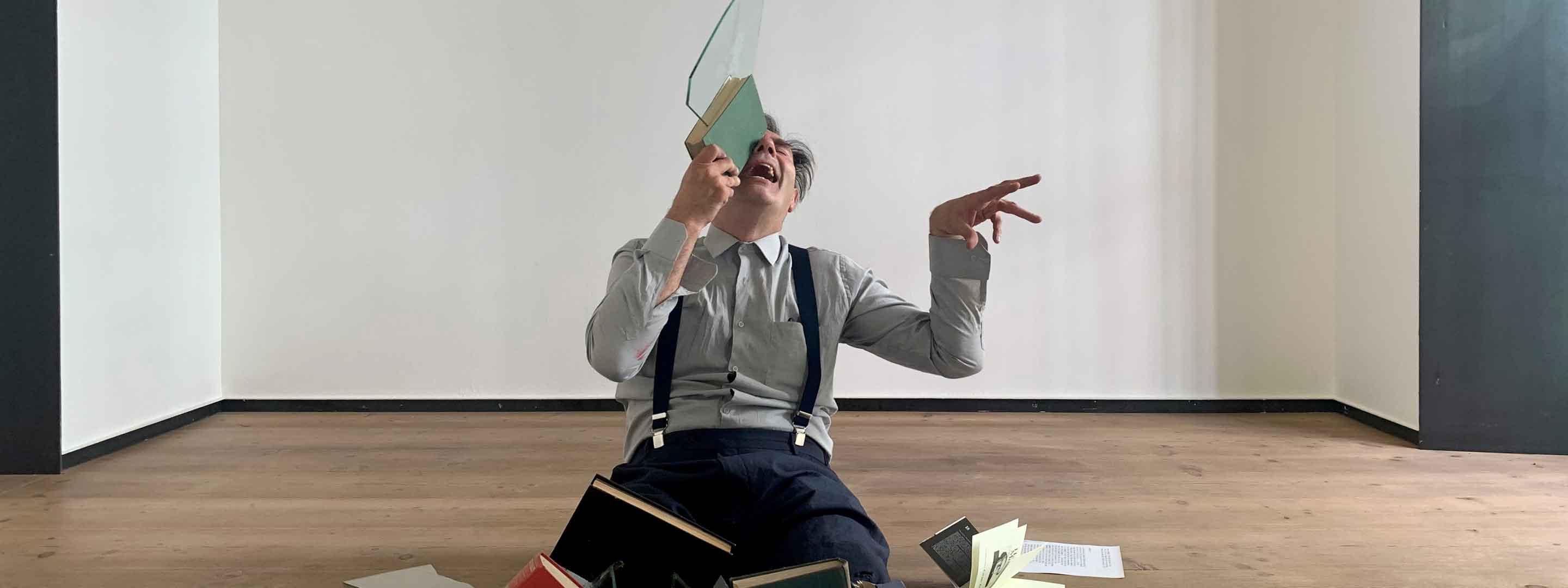 man holding glass sculpture