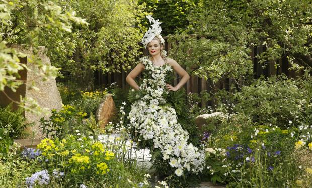 Female model wearing a dress made of flowers in the M&G Garden Thumbnail