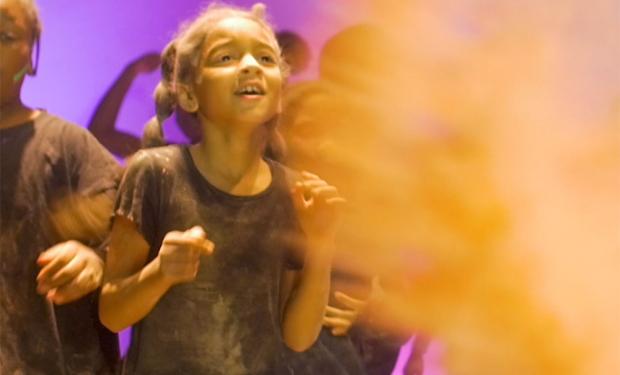 Young girl on stage acting