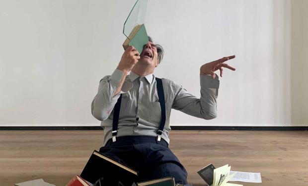 man holding glass sculpture