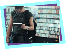 Young person choosing a CD Young person choosing a CD