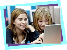 Two girls working on a laptop Two girls working on a laptop