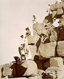 nineteenth century tourists climbing the pyramids