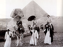 Tourists posed in front of the Sphinx and Great Pyramid, 1905