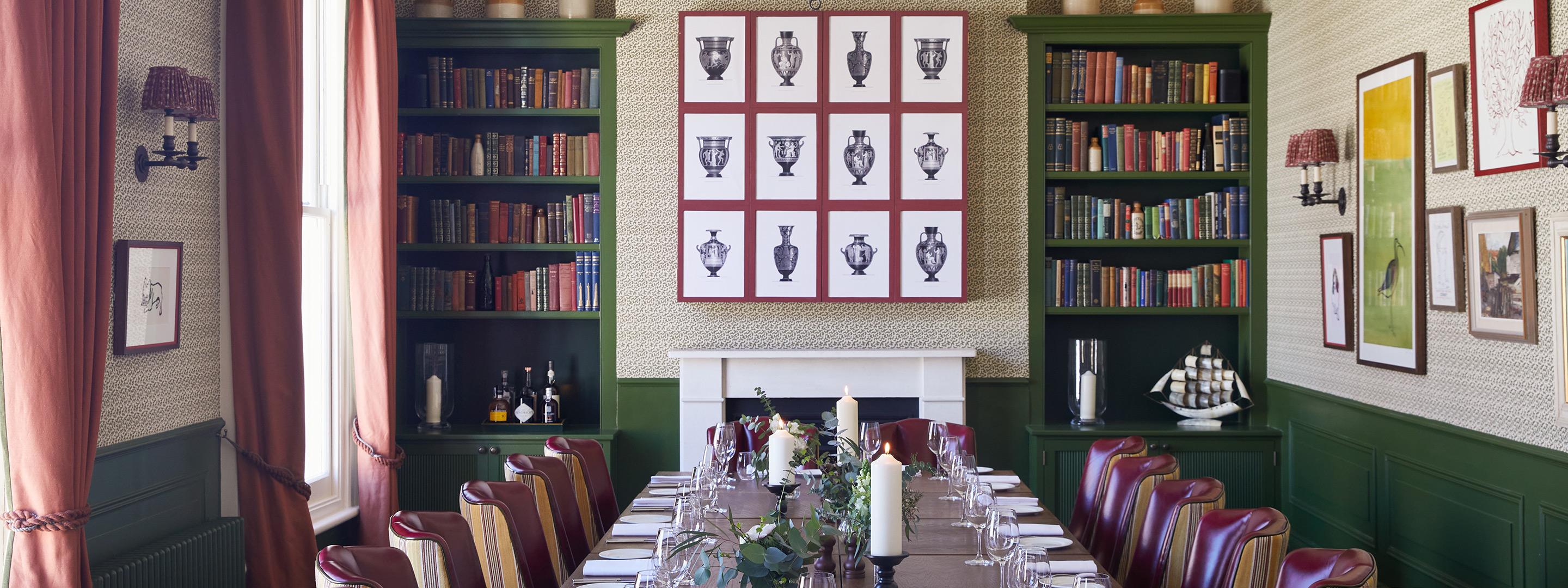 Dining room with large dining table set out for dinner.