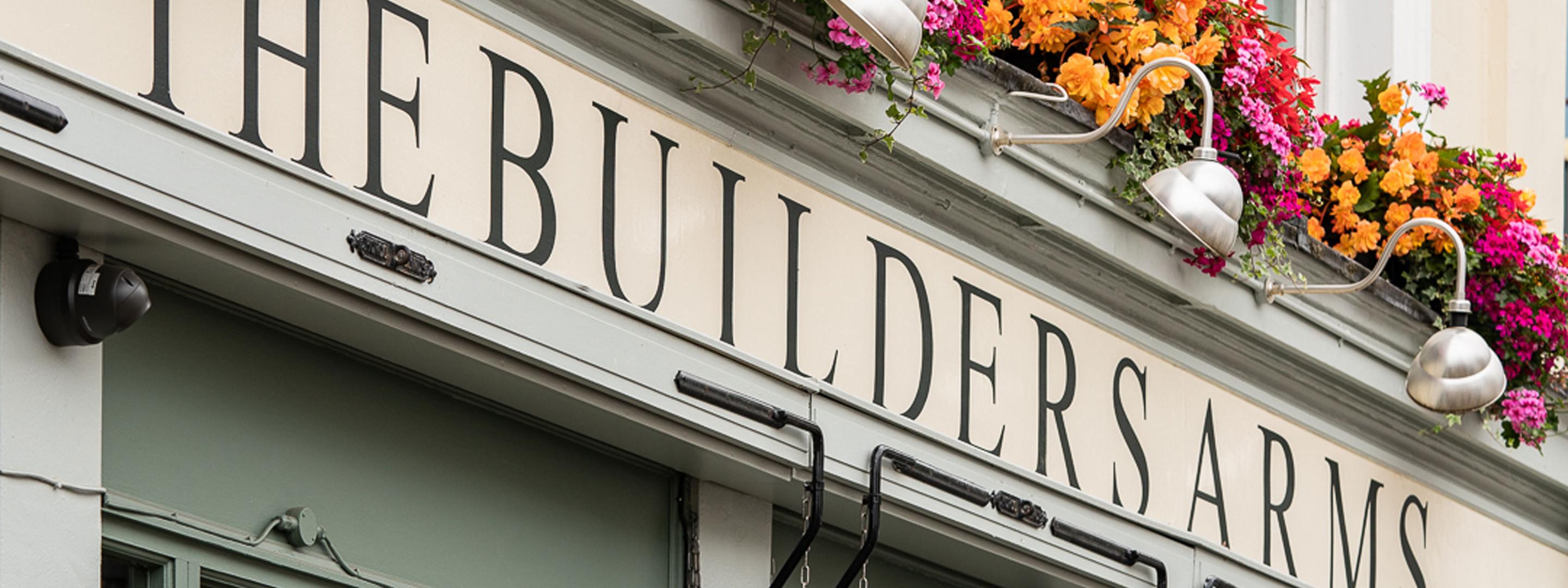 External sign of a pub called builders arms