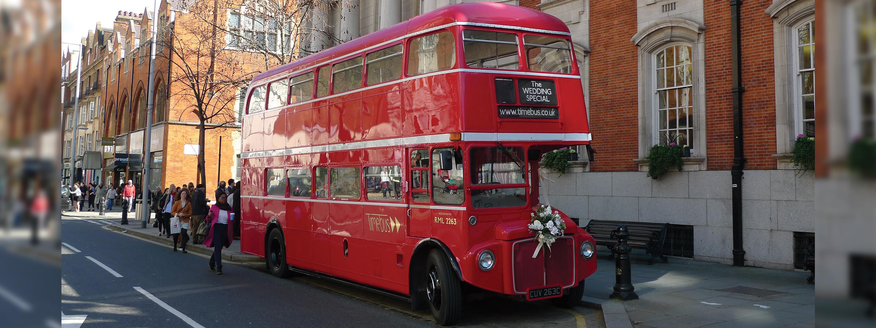 red route bus on the road