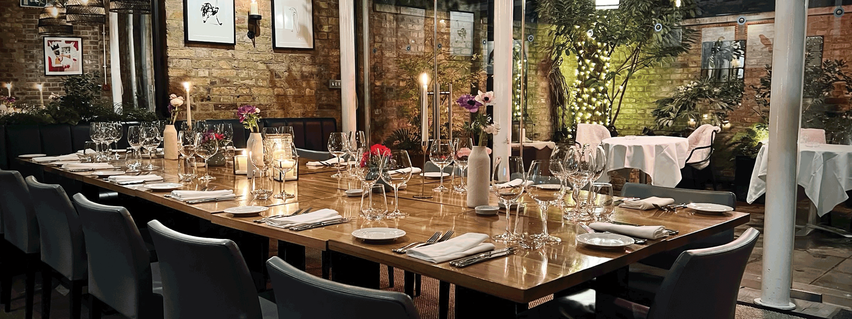 A brown table with chairs underneath