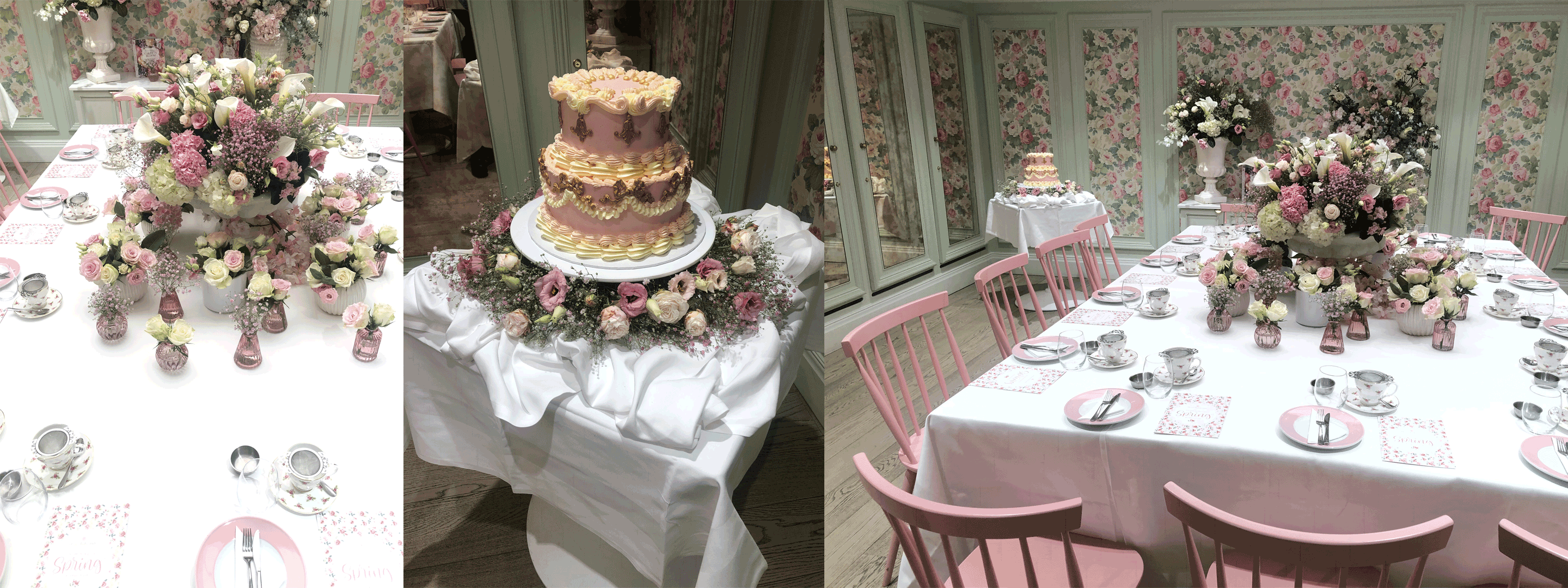 multi coloured flowers and a pink cake on a white table cloth