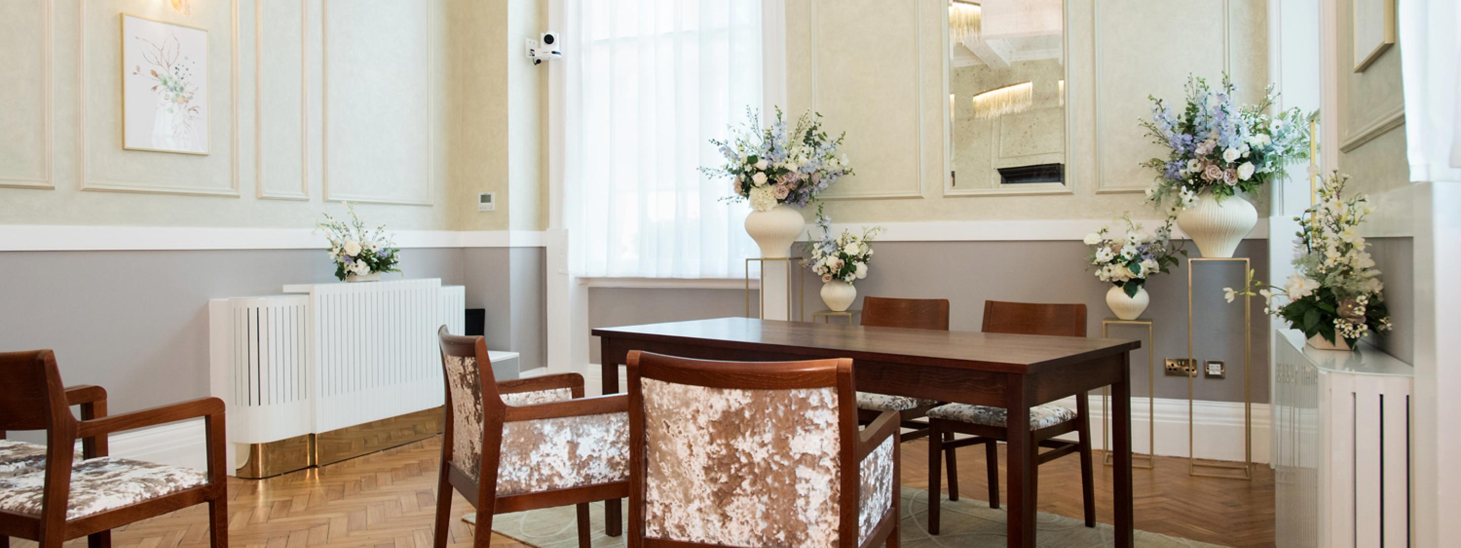 Floral display in the corner of the Brydon room around the signing table.