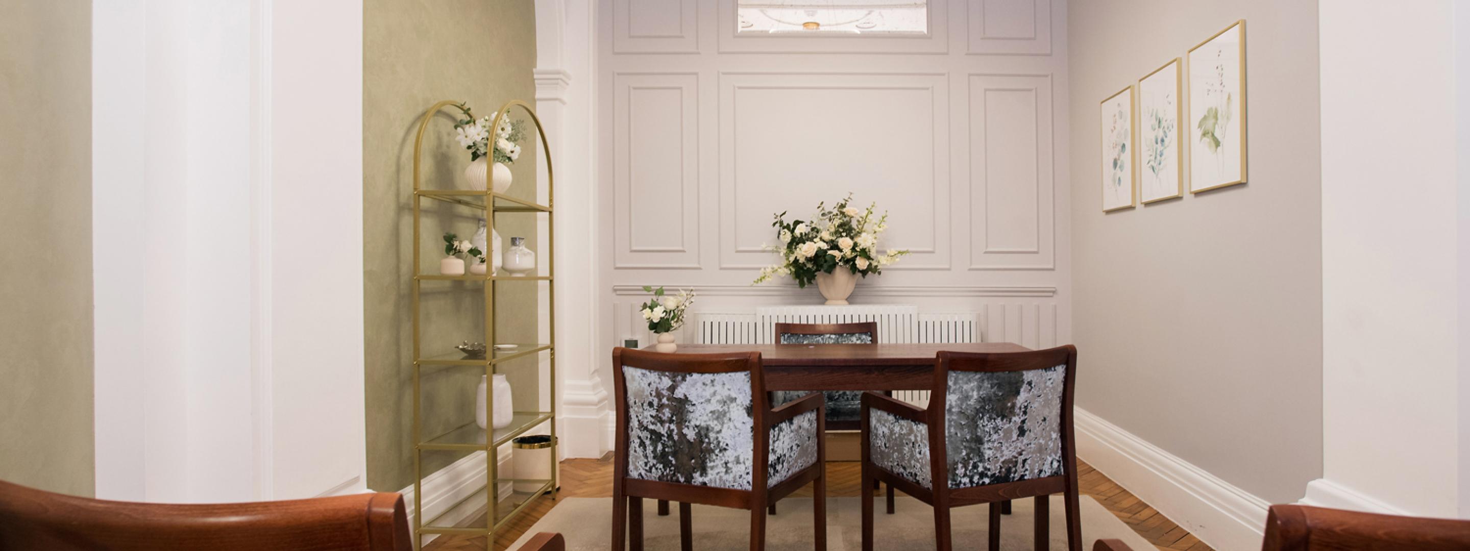 View from afar of the picture table and chairs in the Harrington room