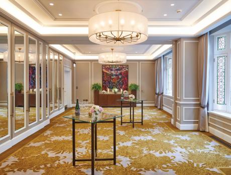 The inside of The Cadogan, room with chandelier set out for reception.