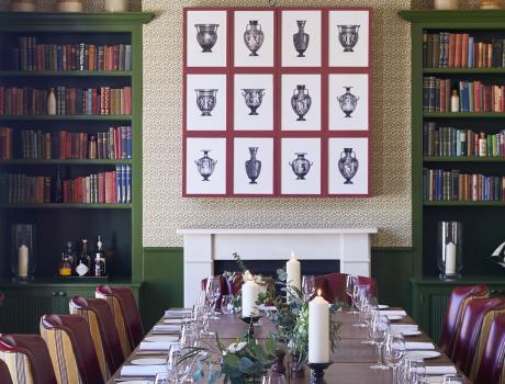 Dining room with large dining table set out for dinner.