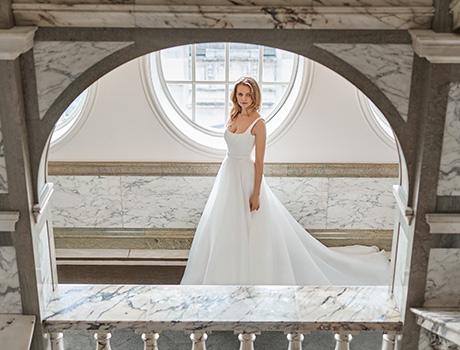 A woman wearing a white wedding dress