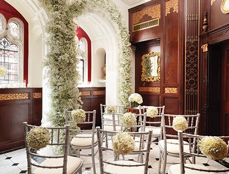 tables and chairs decorated with flowers