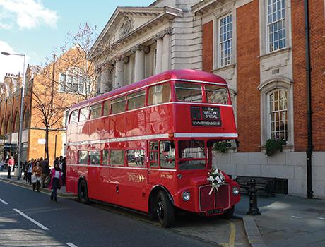 red route bus on the road