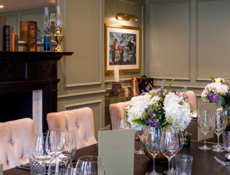 A long table with crockery and chairs