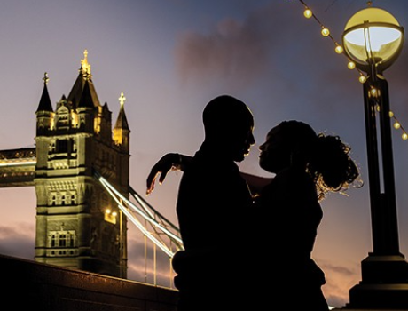 Romantic silhouette of a loving couple outside tower bridge