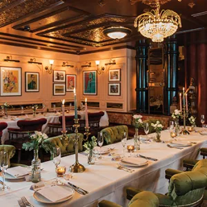 Restaurant table with plates and chairs