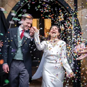 The bride and groom with confetti