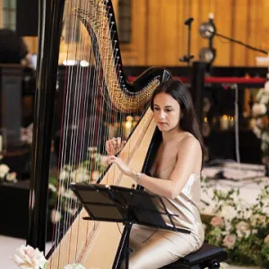 A woman playing a harp