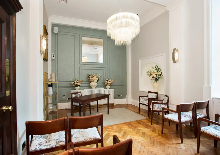 Aerial view of Rossetti room showing seating, feature wall, and lighting.