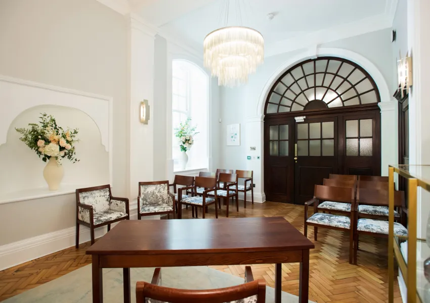 Rear view of Rossetti room showing furniture and glass-panelled door.