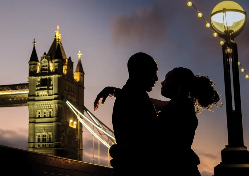 A couple in silhouette with Tower Bridge in the background