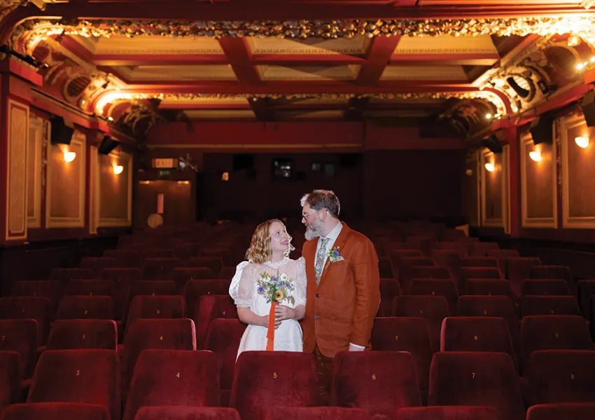 A couple in an elegant cinema