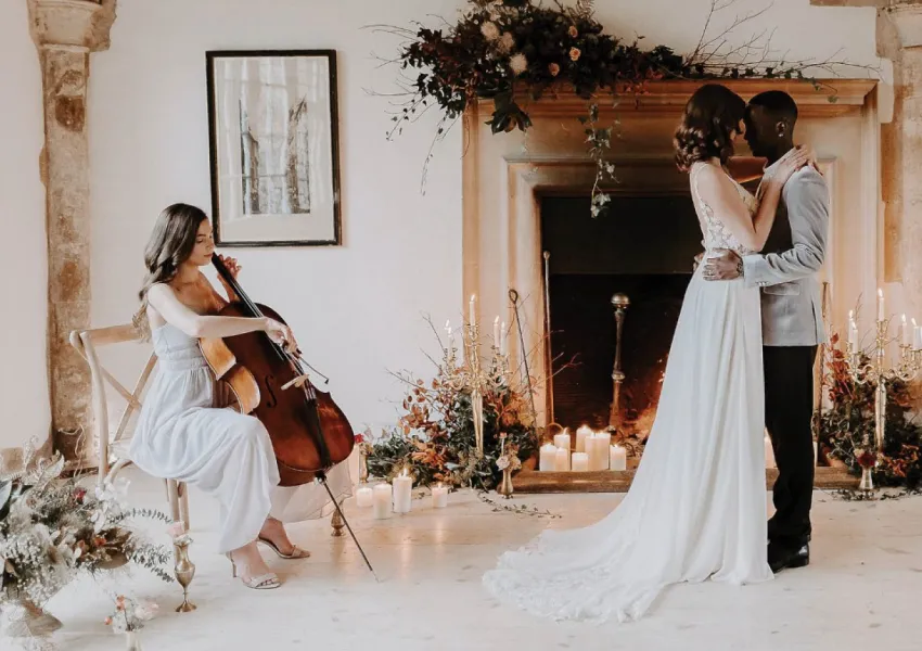 A cellist and a dancing couple