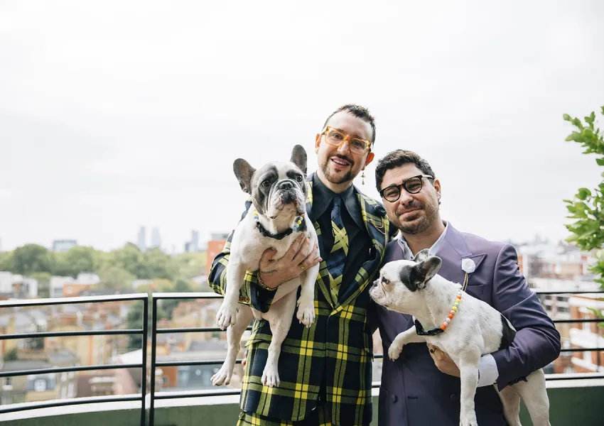 The grooms holding dogs