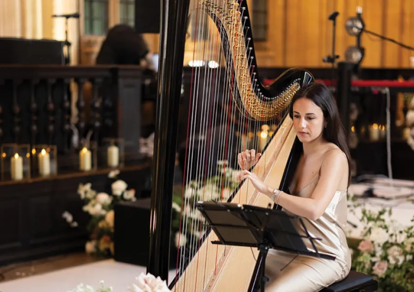 A woman playing a harp