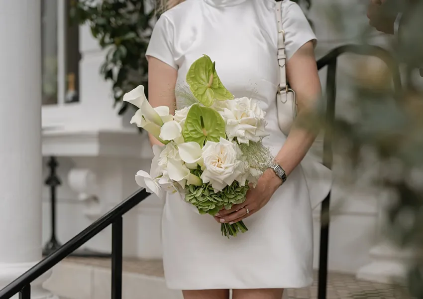 A bride holding a beauriful bouquet of flowers