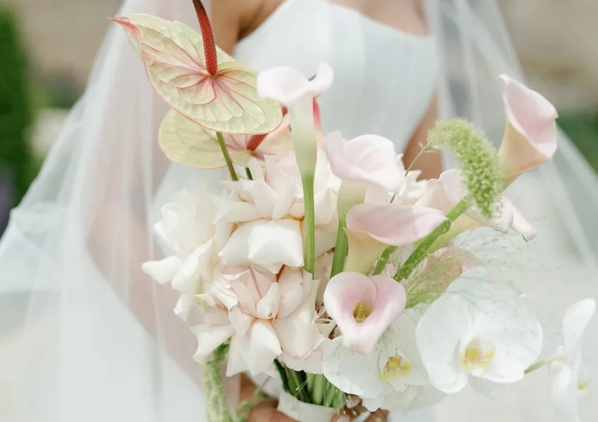 A bride holding a beautiful bouquet of flowers