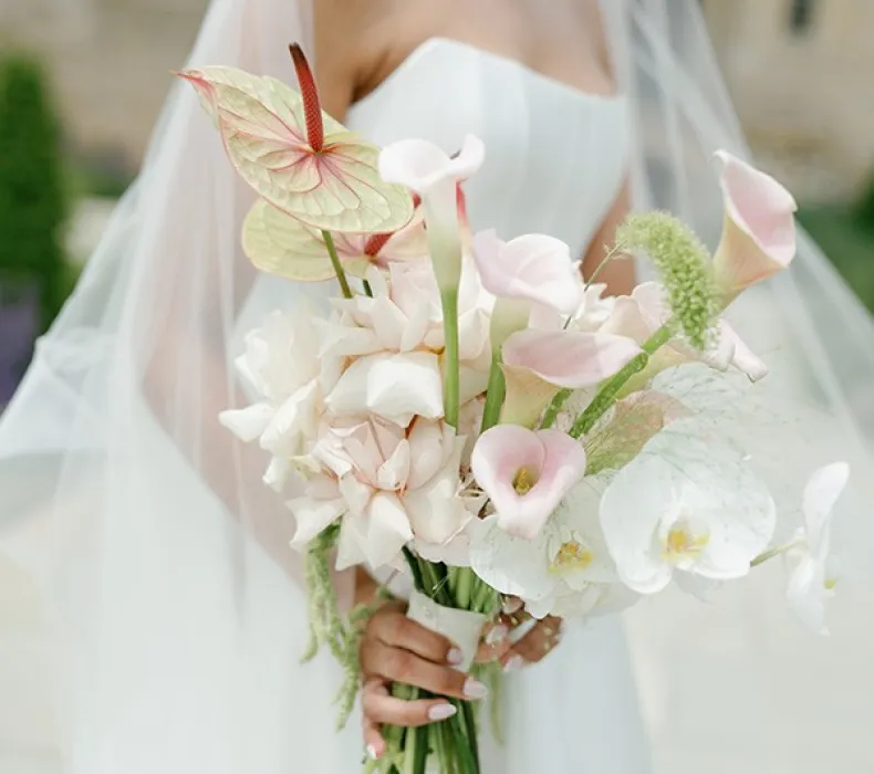 A bride holding a beautiful bouquet of flowers