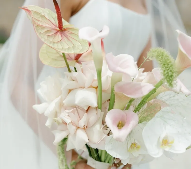 A bride holding a beautiful bouquet of flowers