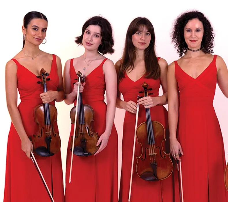 Four women in red dresses holding stringed instruments
