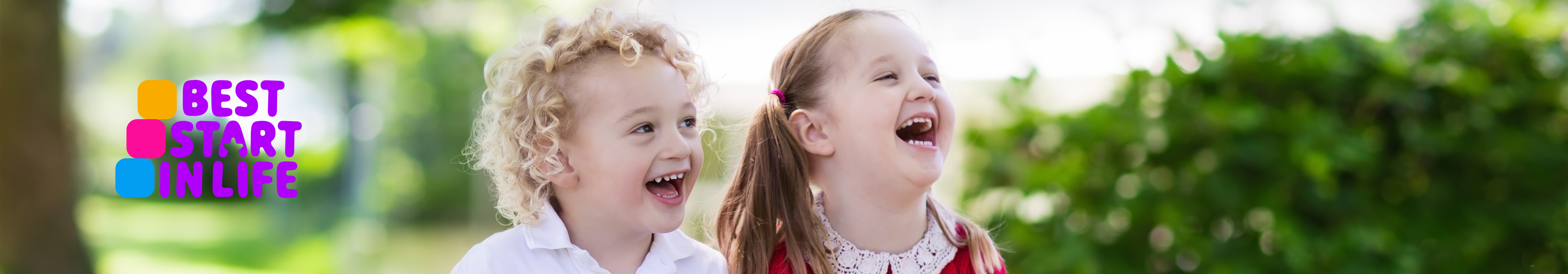 an image of 2 young girls smiling